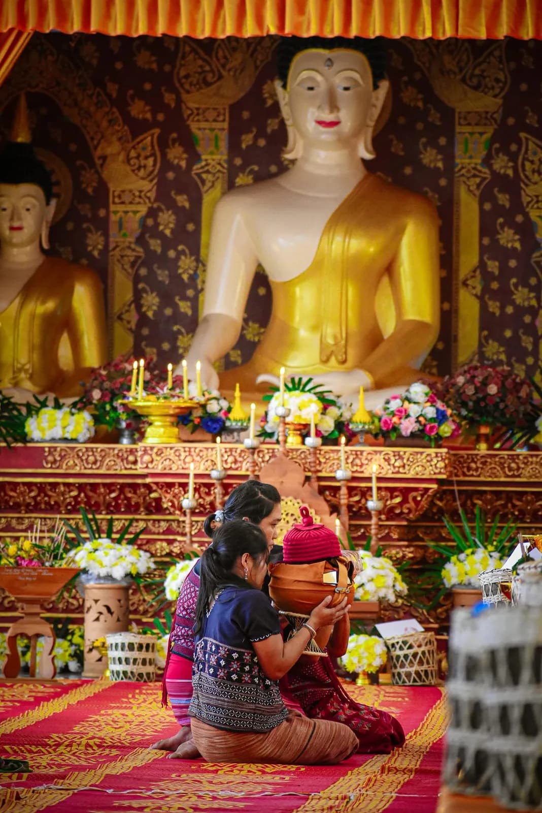 Morning offerings at the temple in Huai Tom